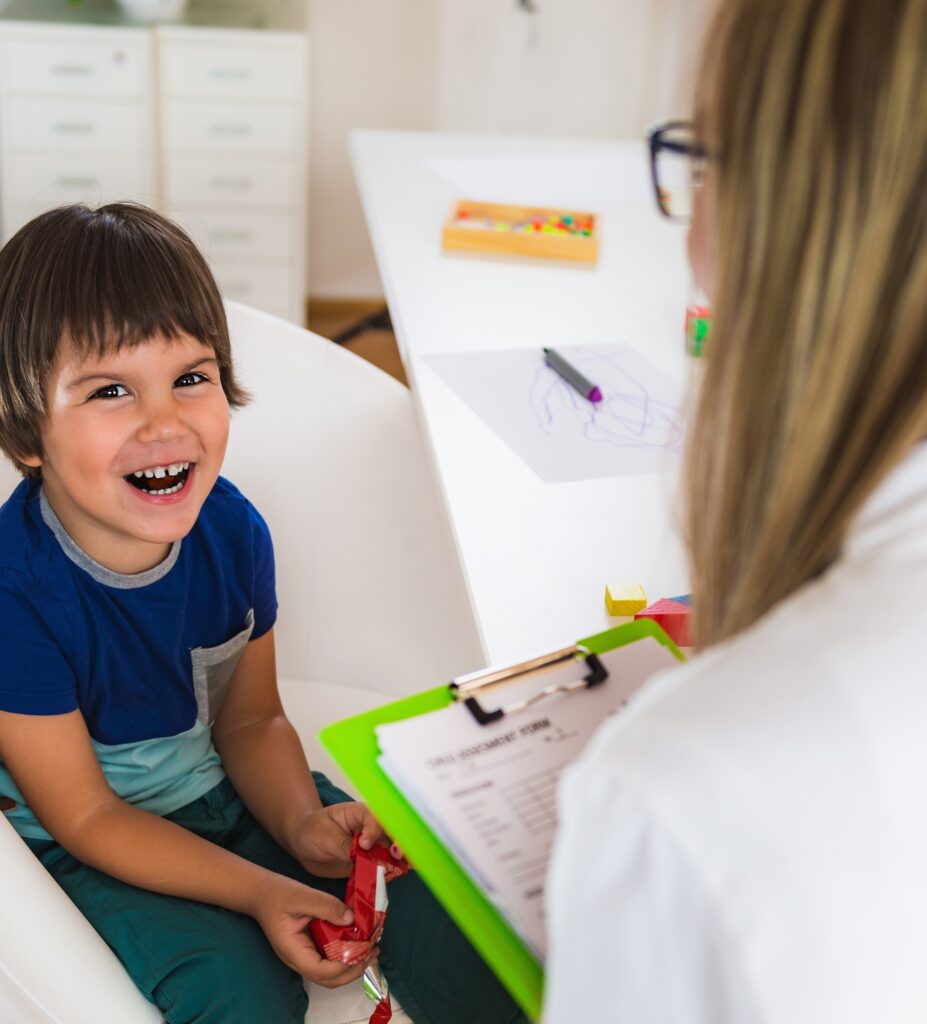 Child psychology, little boy talking to psychologist